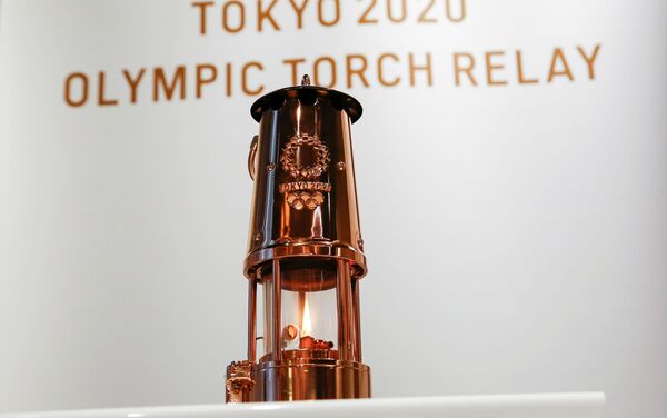La llama de los JJOO de Tokio en el Museo Olímpico de la capital nipona  - Sputnik Mundo