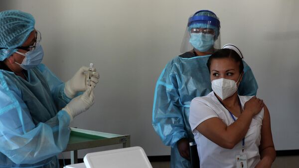 Vacunación contra el coronavirus en Quito, Ecuador - Sputnik Mundo