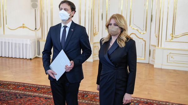 La presidenta de Eslovaquia, Zuzana Caputova, y el ministro de Finanzas, Eduard Heger - Sputnik Mundo