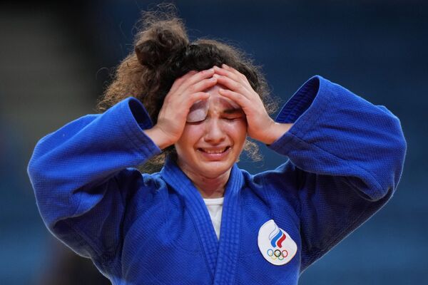 La rusa Madina Taimazova celebra su victoria en la competencia por el tercer lugar en el evento de judo femenino de menos de 70 kg. - Sputnik Mundo
