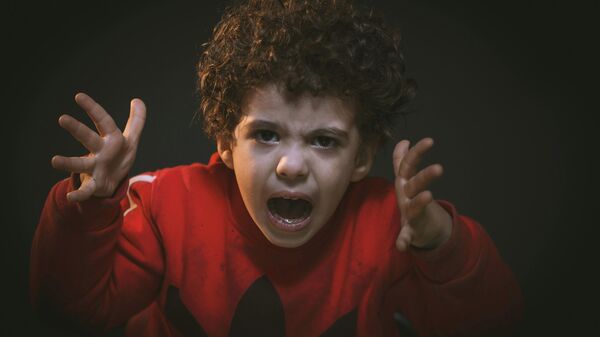 Un niño gritando, imagen ilustrativa - Sputnik Mundo