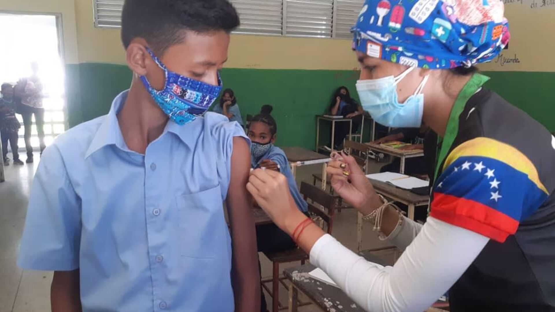 Niños venezolanos reciben la primera dosis de la vacuna Sinopharm contra el COVID-19 - Sputnik Mundo, 1920, 04.01.2022