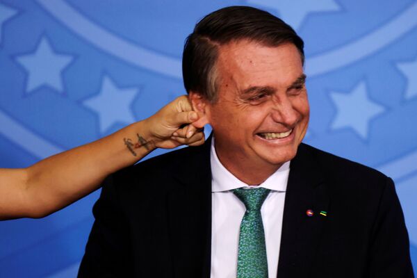 El presidente de Brasil, Jair Bolsonaro, fue nombrado hombre del año por los lectores de la revista Time. - Sputnik Mundo