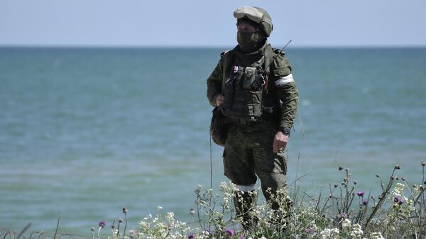 Un militar ruso en Ucrania - Sputnik Mundo