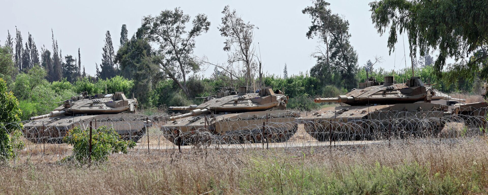 Israeli army Mercava tanks are pictured on the Israel-Gaza border on July 5, 2022. - Sputnik Mundo, 1920, 07.08.2022