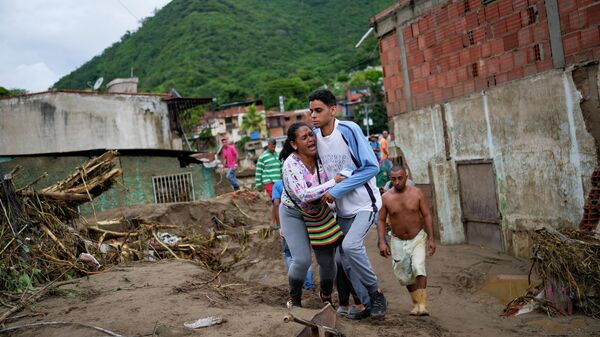Las personas afectadas por el deslave ocurrido en la localidad El Castaño, ubicada en Maracay, estado Aragua (norte)  - Sputnik Mundo