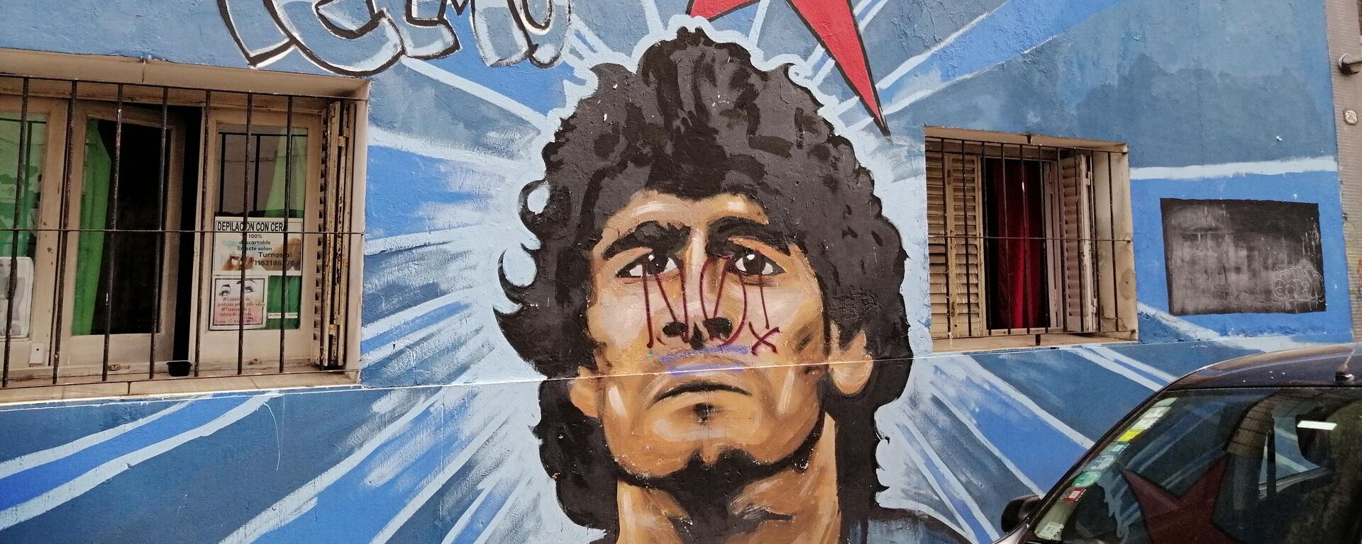 Un retrato de Maradona plasmado en el barrio de San Telmo, en Buenos Aires. - Sputnik Mundo, 1920, 17.12.2022