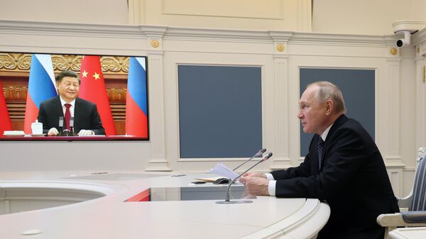 Xi Jinping, presidente de China, y Vladímir Putin, presidente de Rusia, durante una videoconferencia - Sputnik Mundo