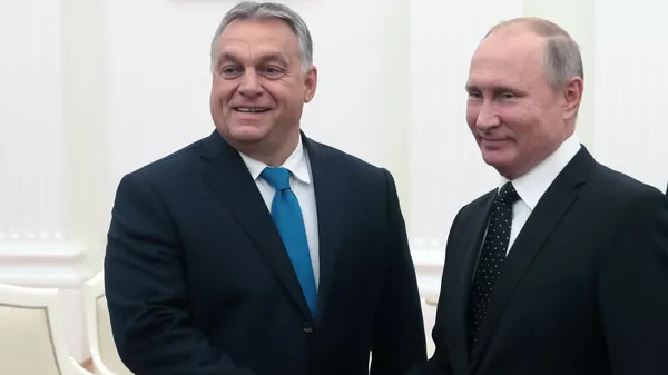 El primer ministro húngaro, Viktor Orban, y el presidente ruso, Vladímir Putin, el 18 de septiembre de 2018 - Sputnik Mundo