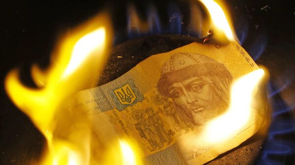 Una grivna ucraniana en llamas (imagen referencial) - Sputnik Mundo