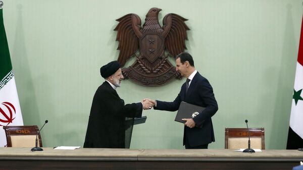 Los presidentes de Irán y Siria, Ibrahim Raisi y Bashar Asad  - Sputnik Mundo