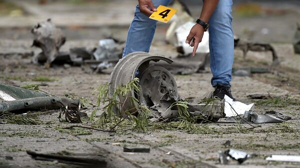 Consecuencias de una explosión de un coche bomba en Colombia - Sputnik Mundo