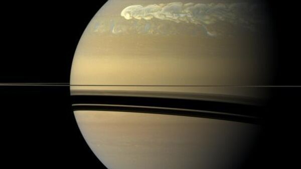 Una foto del huracán en Saturno capturada por la sonda Cassini en 2011 - Sputnik Mundo