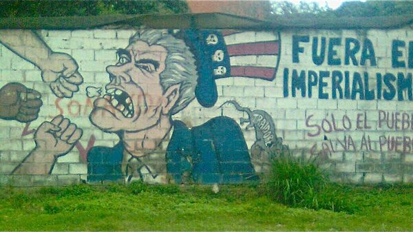 Grafiti en contra del imperialismo estadounidense en una pared en Caracas, Venezuela. - Sputnik Mundo