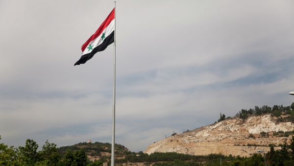 Syrian flag over the capital, Damascus, Syria - Sputnik Mundo