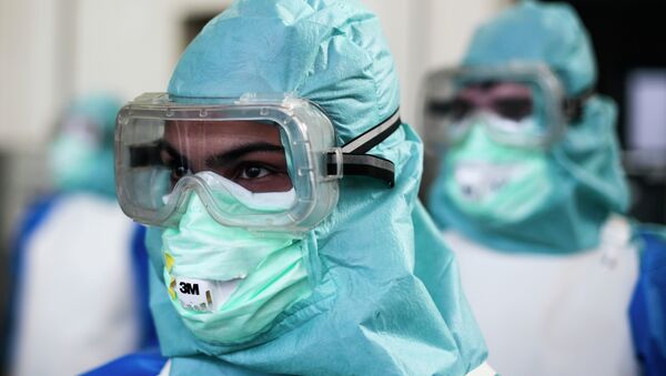 Ebola Health Care Workers - Sputnik Mundo