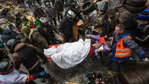 Manifestante herido en la Plaza de la Independencia (Maidán) de Kiev, 2014 - Sputnik Mundo