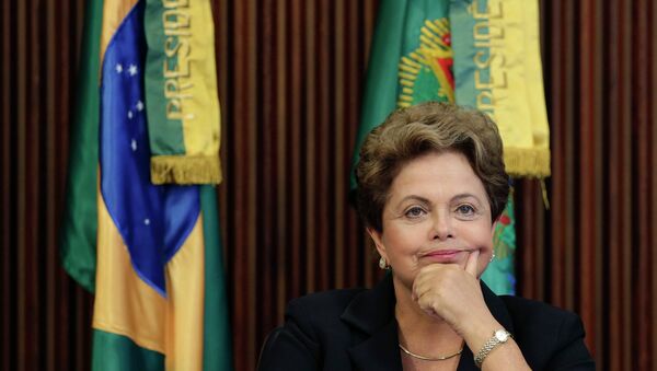 Brazil's President Dilma Rousseff reacts during the sixth meeting of the National Council for Industrial Development (CNDI) at the Planalto Palace in Brasilia February 9, 2015 - Sputnik Mundo