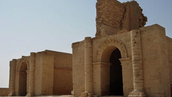 In this file photo taken July 27, 2005, two temples stand over 1,750 years after the Sassanian empire razed the Mesopotamian city of Hatra, 320 kilometers (200 miles) north of Baghdad, Iraq. - Sputnik Mundo