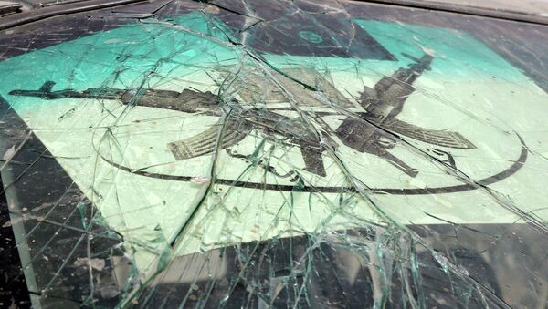 The logo of insurgent group Boko Haram is seen on the cracked windshield of an armored vehicle in Gambaru - Sputnik Mundo