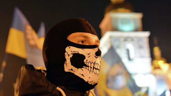 A man takes part in a march in Kiev on October 14, 2014 to mark the founding of the Ukrainian Insurgent Army (UPA) - Sputnik Mundo