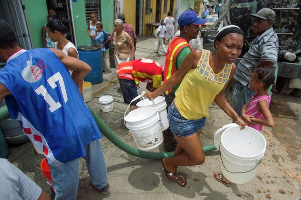 Santo Domingo residents get government-supplied potable water Santo Domingo residents get government-supplied potable water - Sputnik Mundo