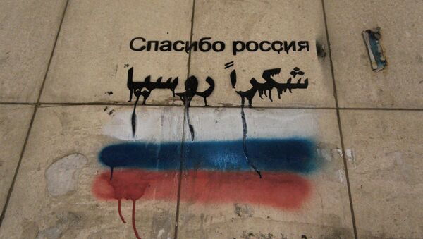 El graffiti en un muro en Siria. La frase dice «Gracias, Rusia» - Sputnik Mundo