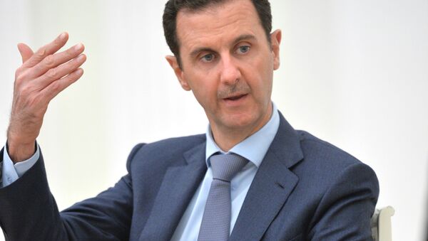 Bashar Asad durante su visita a Moscú - Sputnik Mundo