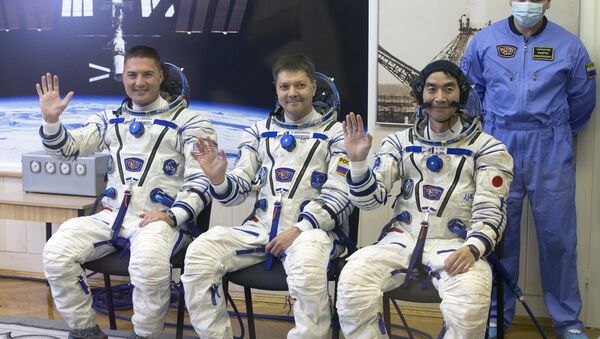 Cosmonautas Kjell Lindgren, Oleg Kononenko y Kimiya Yui (archivo) - Sputnik Mundo