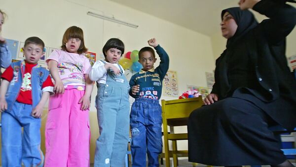 Niños iraquíes con síndrome de Down - Sputnik Mundo