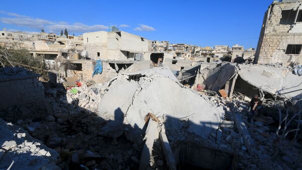 Edificios destruidos por los bombardeos en la ciudad de Turmanin, Siria (archivo) - Sputnik Mundo
