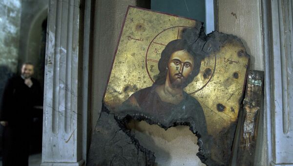 La imagen de Cristo quemada en una iglesia en Siria - Sputnik Mundo