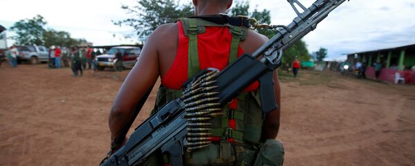 Un combatiente de las FARC Un combatiente de las FARC - Sputnik Mundo
