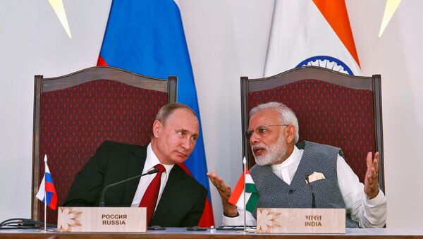Vladimir Putin, el presidente de Rusia, y Narendra Modi, el primer ministro de la India - Sputnik Mundo