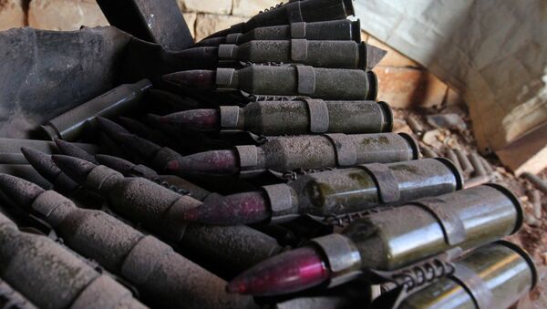 Abandoned magazine of shells is pictured after rebel fighters took control of Dahiyet al-Assad, west Aleppo city - Sputnik Mundo
