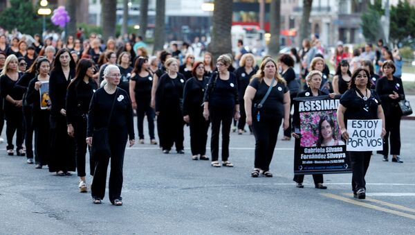 People take part in a demonstration organized by Mujeres de Negro (women in black) against gender violence in Montevideo, Uruguay - Sputnik Mundo