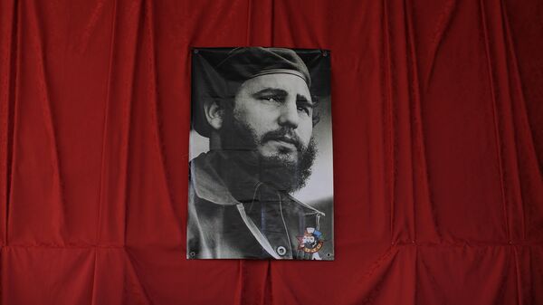 A photograph of the late Fidel Castro hangs at a memorial in his honor in Guanabacoa on the outskirts of Havana, Cuba, Monday, - Sputnik Mundo