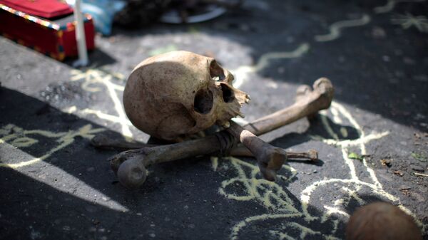 A skull and bones for a voodoo ritual are pictured before a protest against the results of the presidential election in Port-au-Prince, Haiti - Sputnik Mundo