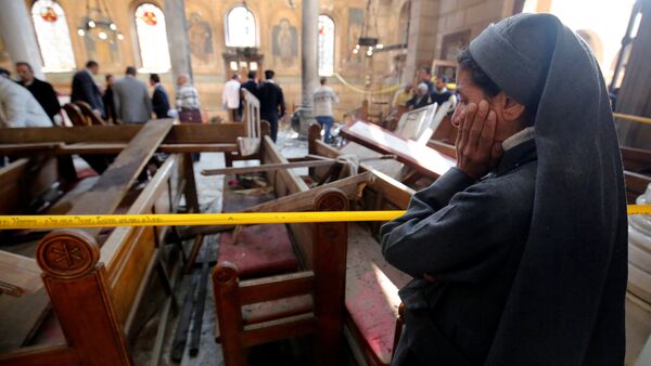 A nun cries as she stands at the scene inside Cairo's Coptic cathedral, following a bombing, in Egypt December 11, 2016 - Sputnik Mundo
