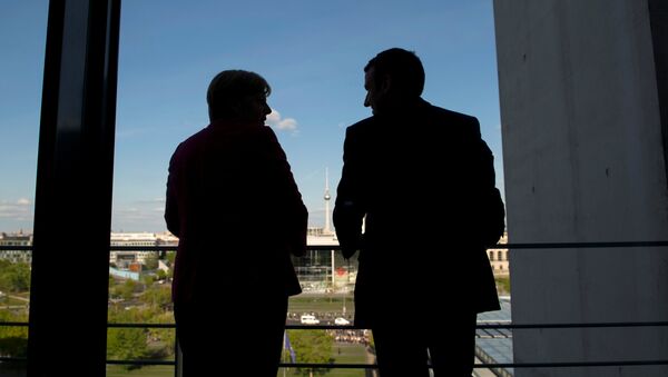 Ángela Merkel, canciller de Alemania, y Emmanuel Macron, presidente de Francia - Sputnik Mundo