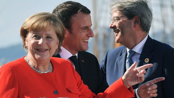 La canciller alemana, Angela Merkel, el presidente de Francia, Emmanuel Macron y el primer ministro italiano Paolo Gentiloni - Sputnik Mundo