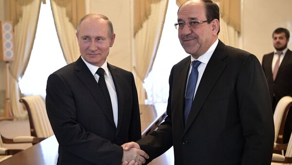 El presidente de Rusia, Vladímir Putin con el vicepresidente iraquí, Nouri Maliki - Sputnik Mundo