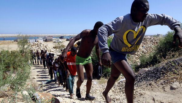Los migrantes libios (archivo) - Sputnik Mundo