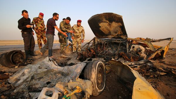 Lugar de explosión de un coche bomba en Irak - Sputnik Mundo