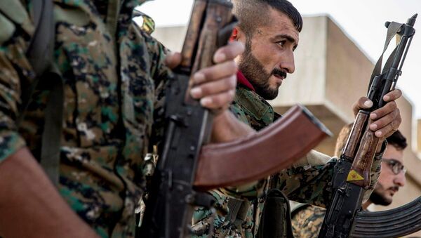 Los combatientes de las Unidades kurdas de Protección Popular (YPG) (imagen referencial) - Sputnik Mundo