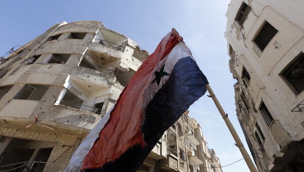 La bandera de Siria en Guta Oriental - Sputnik Mundo