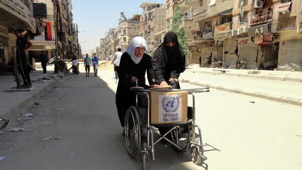 Refugiados palestinos con la ayuda humanitaria de la UNRWA - Sputnik Mundo