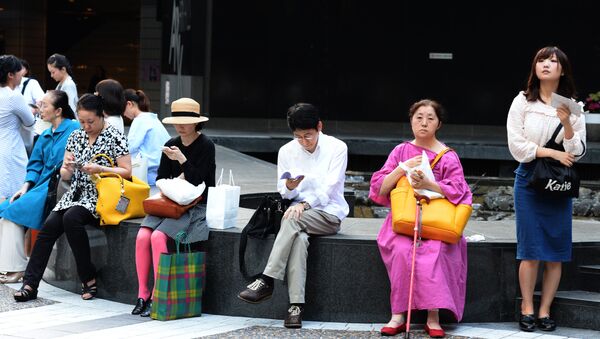Los ciudadanos de Tokio, Japón - Sputnik Mundo