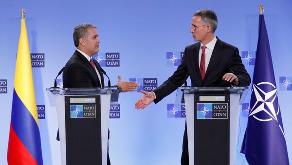 Iván Duque, presidente de Colombia, y Jens Stoltenberg, secretario General de la OTAN - Sputnik Mundo