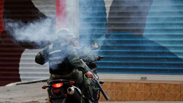 Guardia Nacional Bolivariana durante las protestas en Caracas - Sputnik Mundo